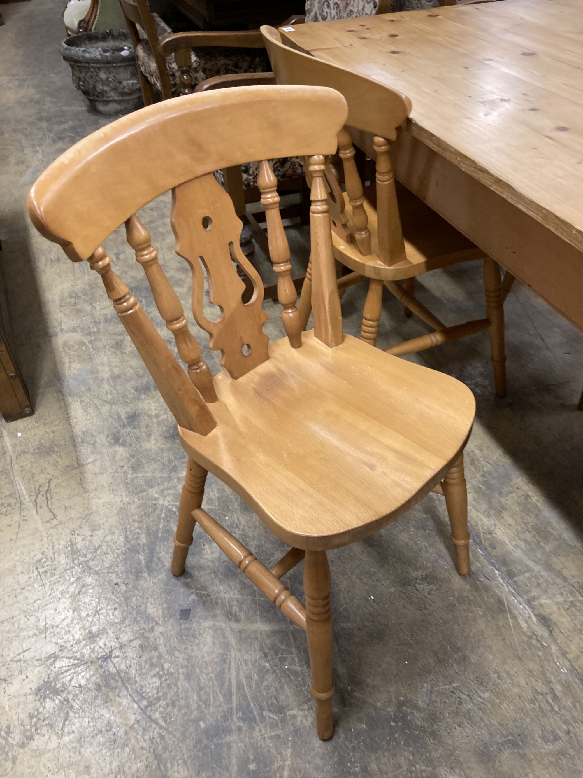 A Victorian style rectangular pine kitchen table, length 152cm, depth 90cm, height 78cm, together with four Windsor beech kitchen chairs